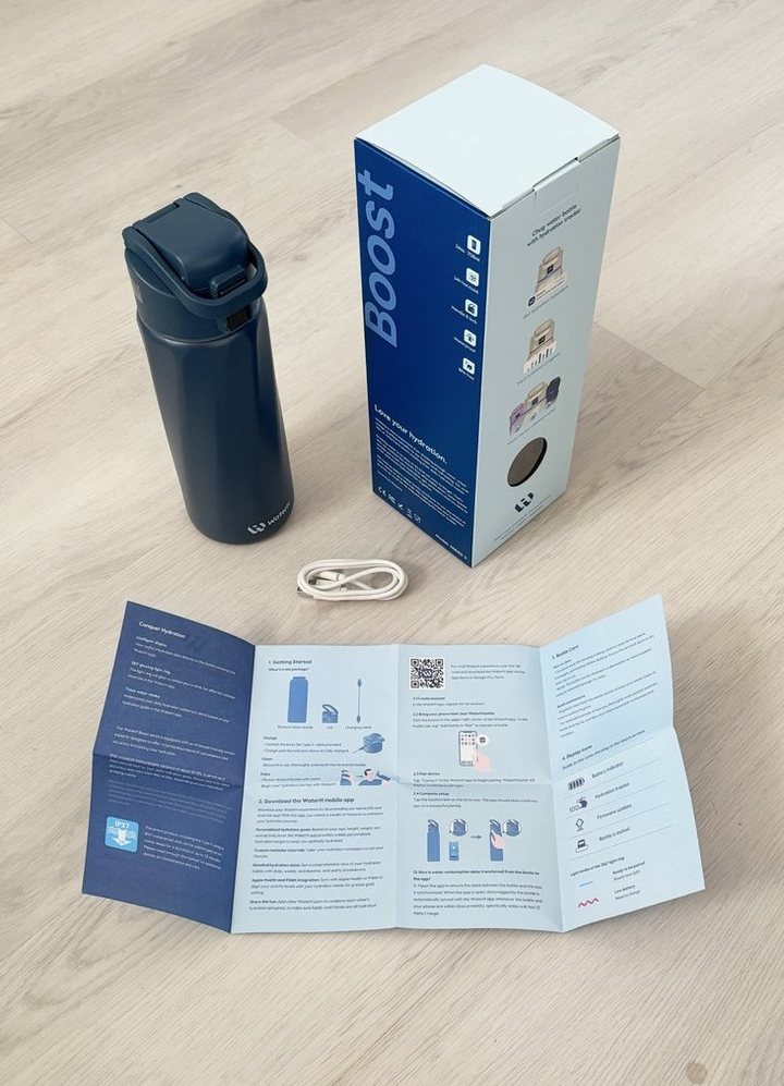 A WaterH bottle with its box and quick-start guide.